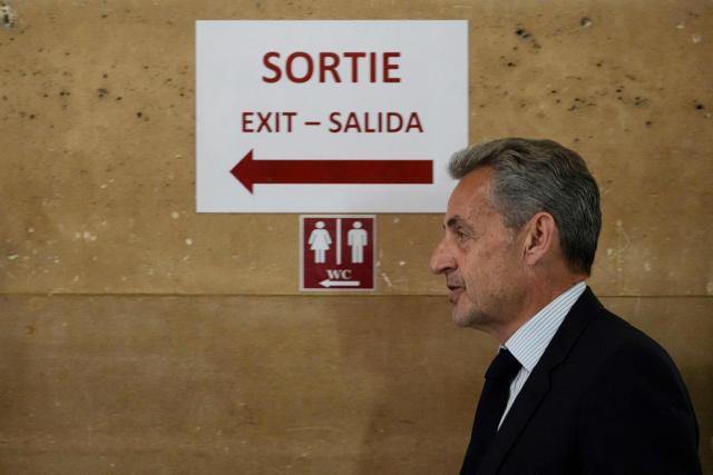 France's former President Nicolas Sarkozy arrives for his final hearing in his appeal trial over charges he had sought Libyan financing for his 2007 election in exchange for helping improve Tripoli's image after deadly bombing, at the Palais de Justice courthouse in Paris on April 29, 2026. (Photo by Dimitar DILKOFF / AFP)