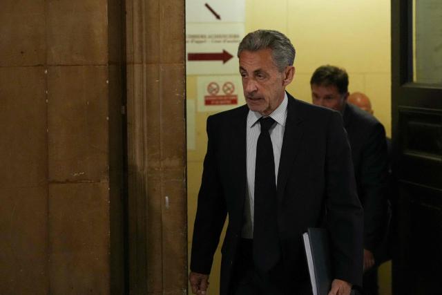 France's former President Nicolas Sarkozy arrives for his final hearing in his appeal trial over charges he had sought Libyan financing for his 2007 election in exchange for helping improve Tripoli's image after deadly bombing, at the Palais de Justice courthouse in Paris on April 29, 2026. (Photo by Dimitar DILKOFF / AFP)