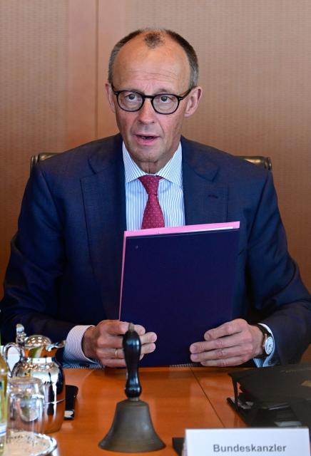 Germany's Chancellor Friedrich Merz gets ready for the weekly cabinet meeting at the Chancellery in Berlin on April 29, 2026. (Photo by John MACDOUGALL / AFP)
