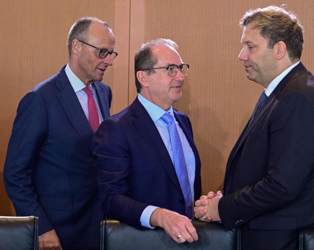 (L-R) Germany's Chancellor Friedrich Merz, Germany's Interior Minister Alexander Dobrindt and German Finance Minister and Vice Chancellor Lars Klingbeil talk prior the start of the weekly cabinet meeting at the Chancellery in Berlin on April 29, 2026. (Photo by John MACDOUGALL / AFP)
