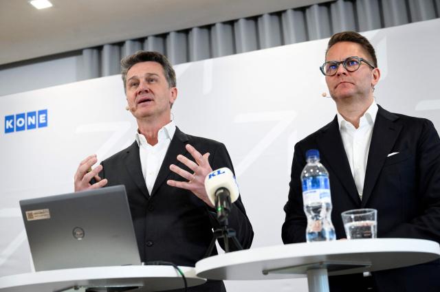 President and Chief Executive Officer (CEO) of Finnish lift company Kone, Philippe Delorme (L) and Chief Financial Officer (CFO) Ilkka Hara address a press conference at the headquarters in Espoo, Finland on April 29, 2026, after the company announced the acquisition of its German rival TKE in a giant share-and-cash deal valuing TKE at 29.4 billion euros (USD 34.4 billion). The group formed by the merger will be nearly twice the size of the current Kone group, with more than 100,000 employees in over 100 countries and annual revenue of around 20.5 billion euros, the two companies said in a statement. (Photo by Emmi Korhonen / Lehtikuva / AFP) / Finland OUT