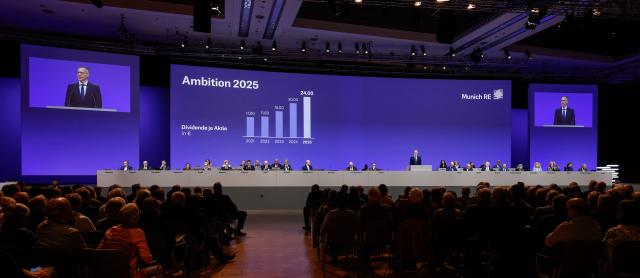 Chief Executive Officer (CEO) of Munich Re Group, Christoph Jurecka (back C-R) addresses shareholders during the Annual General Meeting (AGM) of the reinsurer at the headquarters in Munich, southern Germany, on April 29, 2026. (Photo by Michaela STACHE / AFP)