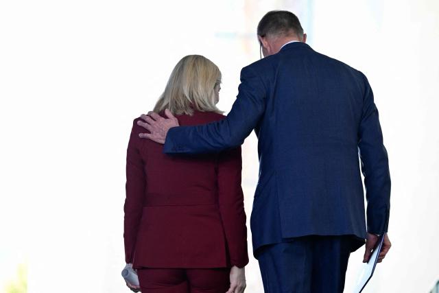 German Chancellor Friedrich Merz and German Health Minister Nina Warken leave after giving a press statement at the Chancellery in Berlin on April 29, 2026. (Photo by John MACDOUGALL / AFP)
