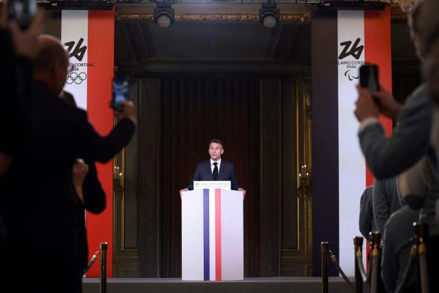 France's President Emmanuel Macron delivers a speech during a medal ceremony for French athletes who competed in the Milan-Cortina 2026 Winter Olympic Games, at the Elysee presidential Palace in Paris, on April 29, 2026. (Photo by Stephanie Lecocq / POOL / AFP)