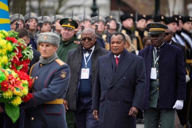 Congo-Brazzaville's President Denis Sassou N'Guesso (2nd R) attends a wreath-laying ceremony at the Tomb of the Unknown Soldier by the Kremlin Wall in Moscow on April 29, 2026. (Photo by Pavel Bednyakov / POOL / AFP)