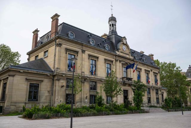 This photograph shows the town hall of Saint-Ouen, a northern suburb of Paris on April 29, 2026. In Saint-Ouen (Seine-Saint-Denis), a showdown is pitting the halal fast-food chain Master Poulet, specialised in low-cost halal grilled chicken, against the Socialist mayor Karim Bouamrane, amid mutual accusations of gentrifying the city and promoting "junk food". (Photo by Martin LELIEVRE / AFP)