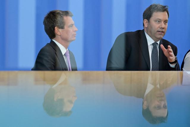 German Finance Minister and Vice Chancellor Lars Klingbeil (R) gives a press conference to present the government's 2027 budget and the financial plan for 2028 to 2030, on April 29, 2026 in Berlin. (Photo by John MACDOUGALL / AFP)