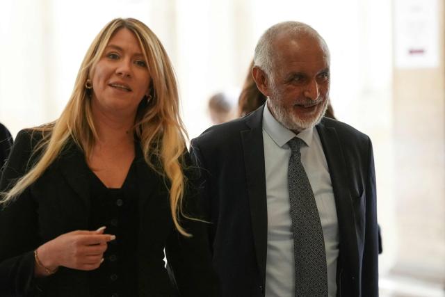French lawyer Jade Dousselin (L) and Defendant French-Djiboutian banker Wahib Nacer arrive after a break during the final hearing in the appeal trial of France's former President Nicolas Sarkozy over charges he had sought Libyan financing for his 2007 election in exchange for helping improve Tripoli's image after deadly bombing, at the Palais de Justice courthouse in Paris on April 29, 2026. (Photo by Dimitar DILKOFF / AFP)
