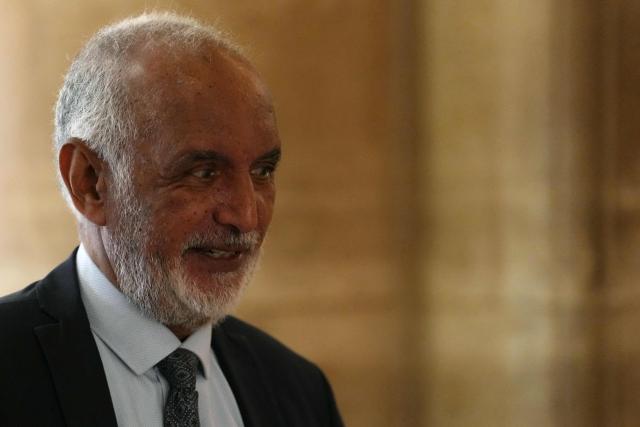 Defendant French-Djiboutian banker Wahib Nacer arrives after a break during the final hearing in the appeal trial of France's former President Nicolas Sarkozy over charges he had sought Libyan financing for his 2007 election in exchange for helping improve Tripoli's image after deadly bombing, at the Palais de Justice courthouse in Paris on April 29, 2026. (Photo by Dimitar DILKOFF / AFP)
