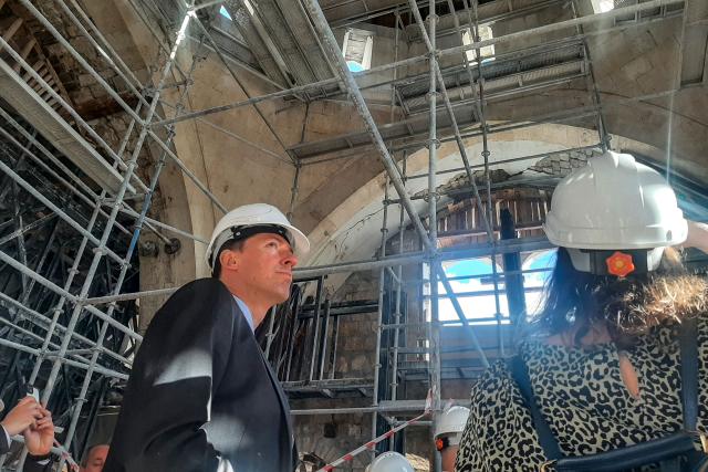 Deputy head of the Delegation of the European Union to Turkey Jurgis Vil?inskas looks on during a visit of a mosque currently undergoing renovation in the old town of Antakya on March 31, 2026, over three years after the earthquake that devastated southeastern Turkey, including Antakya, on February 6, 2023. Nothing is "as it was before" the earthquake that devastated the ancient city and southern Turkey in February 2023, killing at least 53,000 people : Three years after the disaster, residents are denouncing opaque reconstruction plans that threaten to empty the old town and jeopardise its multicultural identity. Once bustling, adjacent to working-class neighbourhoods as well as Muslim, Christian and Jewish places of worship, Kurtulus Avenue is now a vast construction site where listed historic buildings are being hastily rebuilt, with support from the European Union. The old town of Antakya was home to more than 13,000 residents before the earthquake, but virtually no homes will remain, according to the controversial new urban development plan. (Photo by Burcin GERCEK / AFP) / TO GO WITH AFP STORY BY BURC?N GERCEK