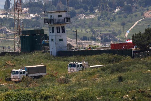 This photograph taken from the northern Israel shows a United Nations (UN) convoy driving through southern Lebanon near the border with Israel, on April 29, 2026. Lebanon's army said on April 29 that one of its soldiers was among two people killed in an Israeli strike in the country's south, the latest deadly raid despite a ceasefire in the Israel-Hezbollah war. (Photo by Jalaa MAREY / AFP)