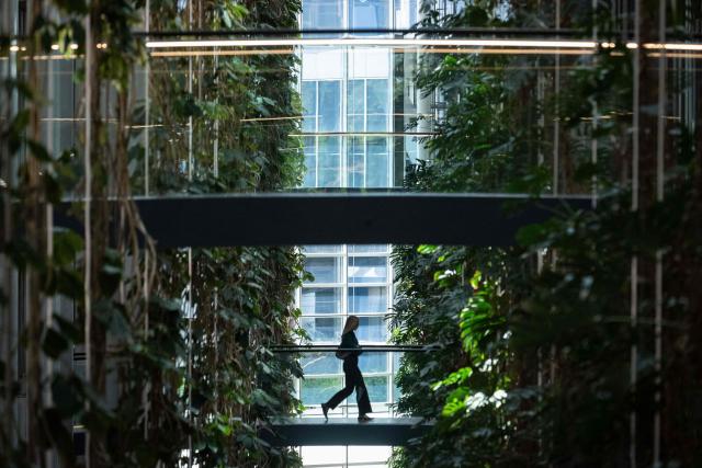 An employee walks on a footbridge at the European Parliament in Strasbourg, eastern France, on April 29, 2026. (Photo by SEBASTIEN BOZON / AFP)