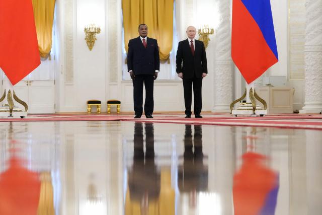 Russia's President Vladimir Putin (R) and Congo-Brazzaville's President Denis Sassou N'Guesso (L) pose for a photo prior to their talks in Moscow on April 29, 2026. (Photo by Pavel Bednyakov / POOL / AFP)