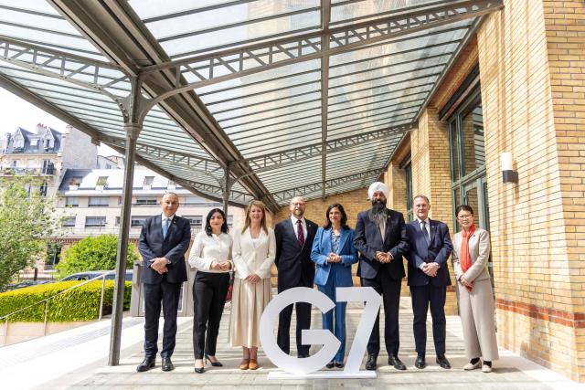 (From L) EU commissioner for International partnerships Josef Sikela, Germany's Development Minister Reem Alabali Radovan, Britain's State Secretary in charge of International Development Jennifer Chapman, US deputy secretary from Migrations and refugees Office Andrew Veprek, France's Minister Delegate for Francophonie Eleonore Caroit, Canada's state secretary in charge of development Randeep Sarai, Italy's Vice-Minister of Foreign Affairs  Edmondo Cirielli and Japan's Foreign Affairs Minister Ayano Kunimitsu pose for a family picture during a G7 Environment Ministers' meeting in Paris on April 29, 2026. The G7 Development Ministers Meeting takes place on 29 and 30 April 2026 in Paris. (Photo by Christophe PETIT TESSON / POOL / AFP)