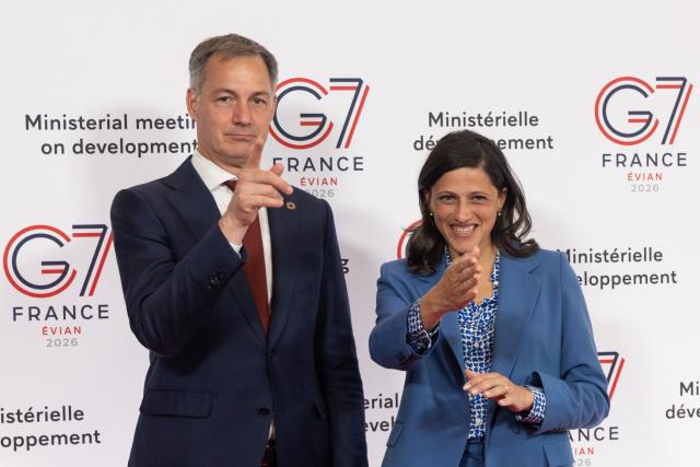 France's Minister Delegate for Francophonie Eleonore Caroit (R) welcomes Administrator of United Nations Development Programme Alexander De Croo (L) during a G7 Environment Ministers' meeting in Paris on April 29, 2026. The G7 Development Ministers’ Meeting takes place on 29 and 30 April 2026 in Paris. (Photo by Christophe PETIT TESSON / POOL / AFP)