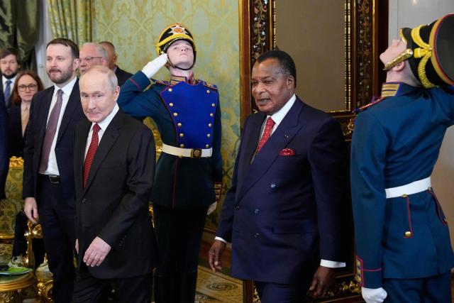 Russia's President Vladimir Putin (L) and Congo-Brazzaville's President Denis Sassou N'Guesso (R) enter a hall during their meeting at the Grand Kremlin Palace in Moscow on April 29, 2026. (Photo by Alexander Zemlianichenko / POOL / AFP)