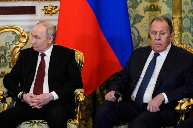 Russia's President Vladimir Putin (L) and Russia's Foreign Minister Sergei Lavrov (R) attend a meeting with Congo-Brazzaville's president in Moscow on April 29, 2026. (Photo by Alexander Zemlianichenko / POOL / AFP)