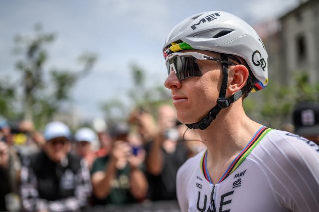 UAE Team Emirates-XRG's Slovenian rider Tadej Pogacar arrives for the teams' presentation prior to the first stage of the Tour of Romandie UCI cycling World tour, a 171.2 km loop from Martigny-Ville to Martigny-Ville, in Martigny on April 29, 2026. (Photo by Fabrice COFFRINI / AFP)