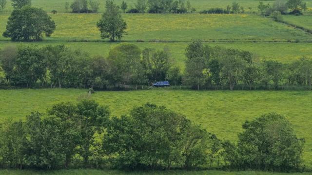 This aerial picture shows French gendarmes searching for missing 31-year-old mother Manon Relandeau, in Saint-Etienne-de-Montluc, western France, on April 29, 2026. The gendarmerie reported an “escalation” in the resources deployed to locate Manon Relandeau, a young mother from the Nantes area who may have been killed, following the arrest of her partner in Algeria. Since April 27, 2026, drones from the IRCGN (National Gendarmerie Criminal Research Institute) have been deployed, a gendarmerie Captain said at a press conference. (Photo by Damien MEYER / AFP)