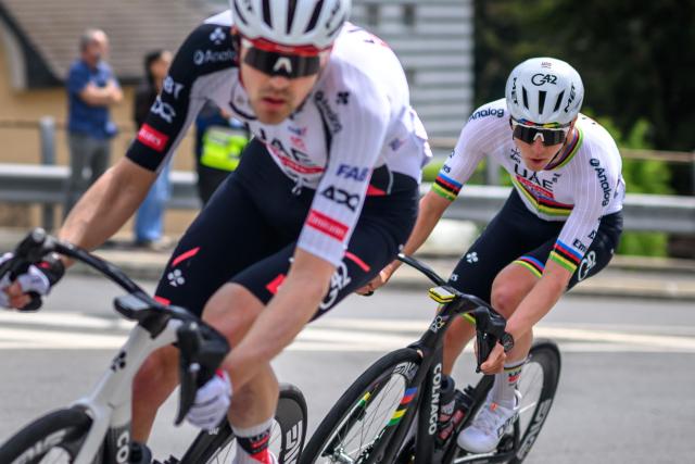 UAE Team Emirates-XRG's Slovenian rider Tadej Pogacar (R) cycles during the first stage of the Tour of Romandie UCI cycling World tour, a 171.2 km loop from Martigny-Ville to Martigny-Ville, in Martigny on April 29, 2026. (Photo by Fabrice COFFRINI / AFP)