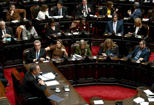 Argentina's Chief of Cabinet Manuel Adorni delivers his management report to the Argentina's congress in Buenos Aires on April 29, 2026. Adorni presents his management report to the Argentina's congress, accompanied by President Javier Milei—a forceful show of support amidst questions regarding his personal assets. (Photo by Luis ROBAYO / AFP)