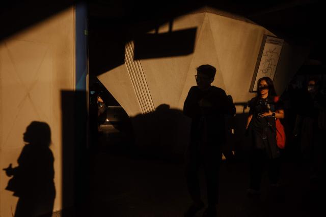 Passengers enter a BTS train station in Bangkok on April 29, 2026. (Photo by ANTHONY WALLACE / AFP)