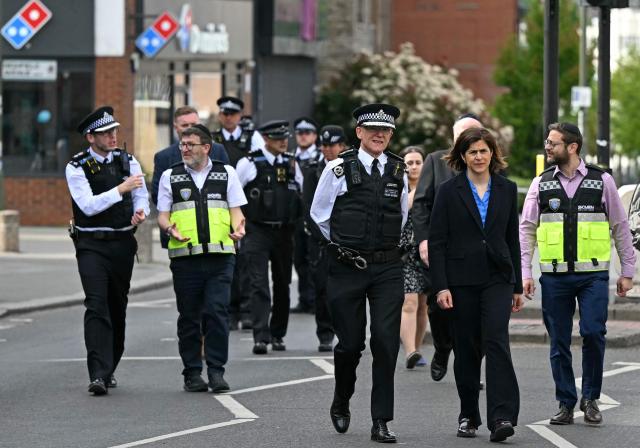 Metropolitan Police Commissioner Mark Rowley (3R) walks within a Police cordon on Golders Green Road, in the Golders Green neighbourhood of north London, on April 29, 2026, after two people were stabbed, and a suspect arrested. The stabbing Wednesday of two Jewish men has been formally declared "a terrorist incident", London police said, with officers investigating "whether this attack was deliberately targeting the Jewish community". "Our highly specialised teams of officers are working... to progress this investigation quickly and establish exactly what has happened," said Assistant Commissioner Laurence Taylor, head of counter-terrorism policing. (Photo by JUSTIN TALLIS / AFP)