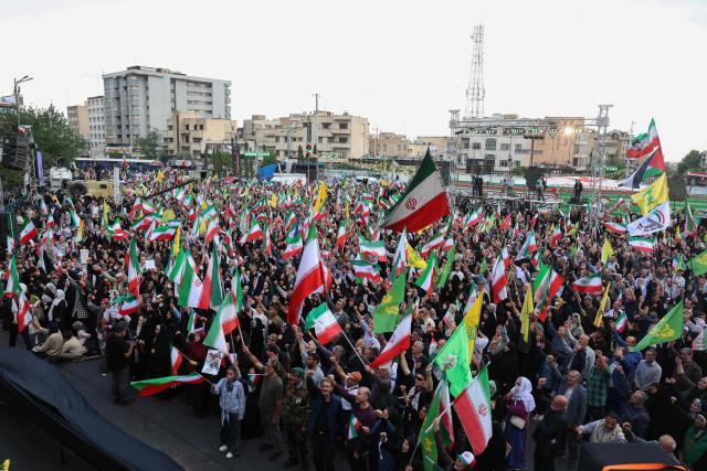 Iranians as hold Iran’s national flags during a rally to show their solidarity and support to new Iranian supreme leader Ayatollah Mojataba Khamenei in Tehran, April 29 2026. US President Donald Trump on April 29 warned Iran to "better get smart soon" as efforts by Washington and Tehran to end hostilities appeared at a standstill. (Photo by AFP) / 