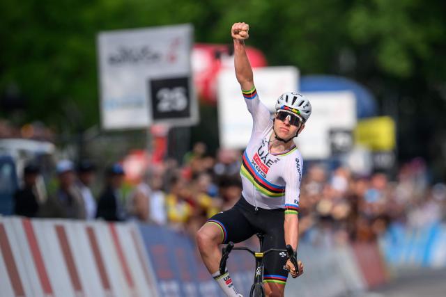UAE Team Emirates-XRG's Slovenian rider Tadej Pogacar celebrates as he crosses the finish line to win the first stage of the Tour of Romandie UCI cycling World tour, a 171.2 km loop from Martigny-Ville to Martigny-Ville, in Martigny, on April 29, 2026. (Photo by Fabrice COFFRINI / AFP)
