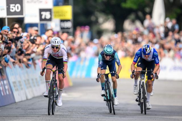 UAE Team Emirates-XRG's Slovenian rider Tadej Pogacar (R) sprints ahead of Bahrain Victorious' French rider Lenny Martinez (C) and Red Bull BORA hansgrohe's German rider Florian Lipowitz at the end of the first stage of the Tour of Romandie UCI cycling World tour, a 171.2 km loop from Martigny-Ville to Martigny-Ville, in Martigny, on April 29, 2026. (Photo by Fabrice COFFRINI / AFP)