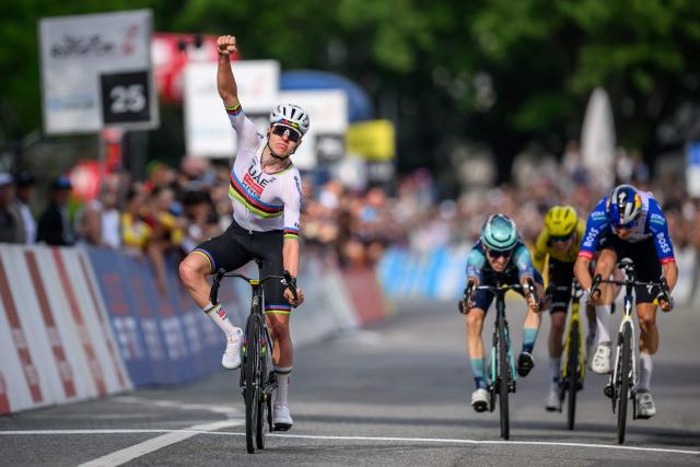 UAE Team Emirates-XRG's Slovenian rider Tadej Pogacar (L) celebrates as he crosses the finish line ahead of Bahrain Victorious' French rider Lenny Martinez (C), Team Visma–Lease a Bike's Norwegian rider Jorgen Nordhagen (2nd R) and Red Bull BORA hansgrohe's German rider Florian Lipowitz to win the first stage of the Tour of Romandie UCI cycling World tour, a 171.2 km loop from Martigny-Ville to Martigny-Ville, in Martigny, on April 29, 2026. (Photo by Fabrice COFFRINI / AFP)