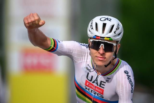 UAE Team Emirates-XRG's Slovenian rider Tadej Pogacar celebrates as he crosses the finish line to win the first stage of the Tour of Romandie UCI cycling World tour, a 171.2 km loop from Martigny-Ville to Martigny-Ville, in Martigny, on April 29, 2026. (Photo by Fabrice COFFRINI / AFP)