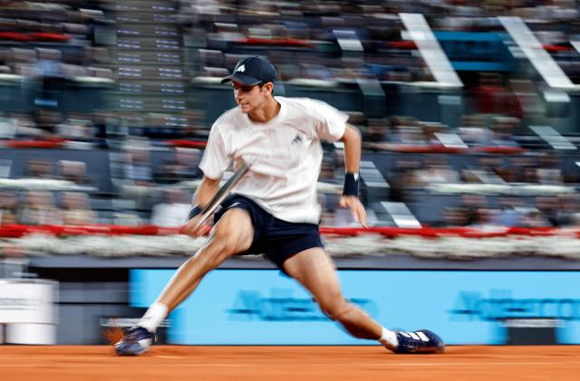 Spain's Rafael Jodar returns a ball to Italy's Jannik Sinner during their 2026 ATP Tour Madrid Open tennis tournament quarterfinal singles match at the Caja Magica in Madrid, on April 29, 2026. (Photo by OSCAR DEL POZO / AFP)