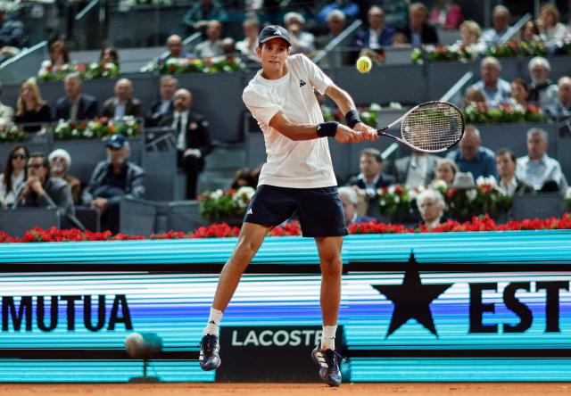 Spain's Rafael Jodar returns a ball to Italy's Jannik Sinner during their 2026 ATP Tour Madrid Open tennis tournament quarterfinal singles match at the Caja Magica in Madrid, on April 29, 2026. (Photo by OSCAR DEL POZO / AFP)