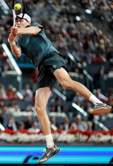 Italy's Jannik Sinner returns a ball to Spain's Rafael Jodar during their 2026 ATP Tour Madrid Open tennis tournament quarterfinal singles match at the Caja Magica in Madrid, on April 29, 2026. (Photo by OSCAR DEL POZO / AFP)