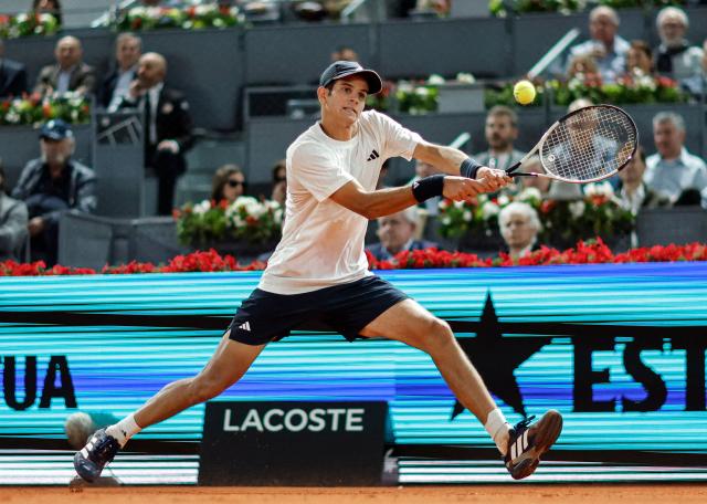 Spain's Rafael Jodar returns a ball to Italy's Jannik Sinner during their 2026 ATP Tour Madrid Open tennis tournament quarterfinal singles match at the Caja Magica in Madrid, on April 29, 2026. (Photo by OSCAR DEL POZO / AFP)