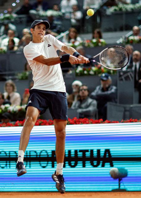 Spain's Rafael Jodar returns a ball to Italy's Jannik Sinner during their 2026 ATP Tour Madrid Open tennis tournament quarterfinal singles match at the Caja Magica in Madrid, on April 29, 2026. (Photo by OSCAR DEL POZO / AFP)