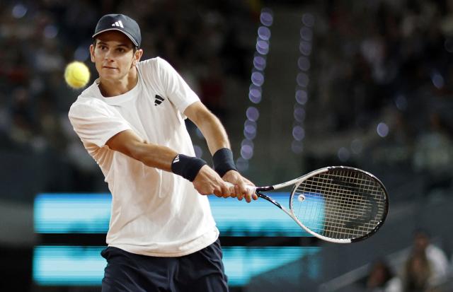 Spain's Rafael Jodar returns a ball to Italy's Jannik Sinner during their 2026 ATP Tour Madrid Open tennis tournament quarterfinal singles match at the Caja Magica in Madrid, on April 29, 2026. (Photo by OSCAR DEL POZO / AFP)