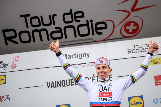 UAE Team Emirates-XRG's Slovenian rider Tadej Pogacar gives the thumbs up on the podium after winning at the end of the first stage of the Tour of Romandie UCI cycling World tour, a 171.2 km loop from Martigny-Ville to Martigny-Ville, in Martigny, on April 29, 2026. (Photo by Fabrice COFFRINI / AFP)