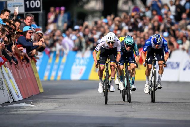UAE Team Emirates-XRG's Slovenian rider Tadej Pogacar (L) sprints to win the first stage of the Tour of Romandie UCI cycling World tour, a 171.2 km loop from Martigny-Ville to Martigny-Ville, in Martigny, on April 29, 2026. (Photo by Fabrice COFFRINI / AFP)