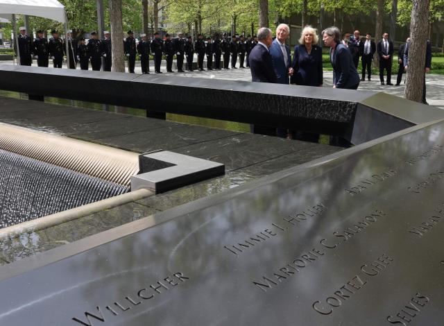 Britain's King Charles III and Queen Camilla visit the 9/11 Memorial alongside former New York mayor Michael Bloomberg (L) and Beth Hillman, CEO of the 9/11 Memorial and Museum, in New York on April 29, 2026. (Photo by TIMOTHY A. CLARY / AFP)