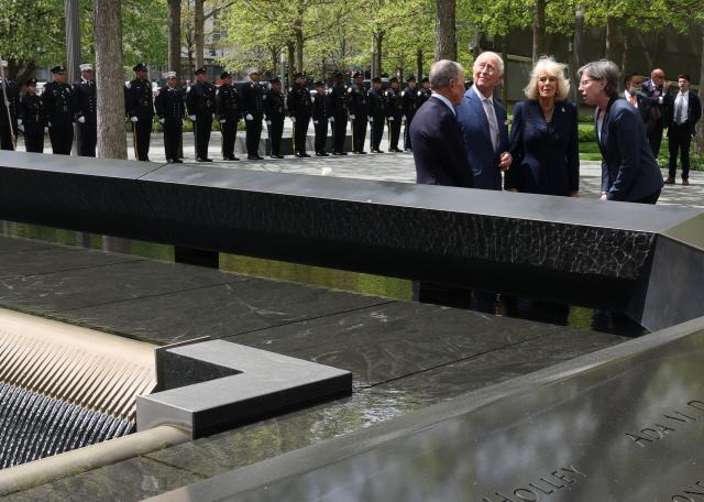 Britain's King Charles III and Queen Camilla visit the 9/11 Memorial alongside former New York mayor Michael Bloomberg (L) and Beth Hillman, CEO of the 9/11 Memorial and Museum, in New York on April 29, 2026. (Photo by TIMOTHY A. CLARY / AFP)