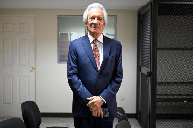 Guatemalan journalist and founder of the former newspaper "El Periodico," Jose Ruben Zamora, poses for pictures before his hearing at the Justice Palace in Guatemala City on April 29, 2026. A court hearing will decide whether Zamora should stand trial in a second case against him. (Photo by Johan ORDONEZ / AFP)