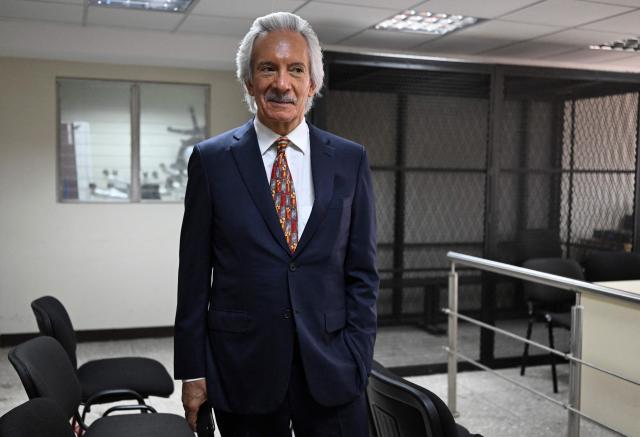 Guatemalan journalist and founder of the former newspaper "El Periodico," Jose Ruben Zamora, listens journalists before his hearing at the Justice Palace in Guatemala City on April 29, 2026. A court hearing will decide whether Zamora should stand trial in a second case against him. (Photo by Johan ORDONEZ / AFP)