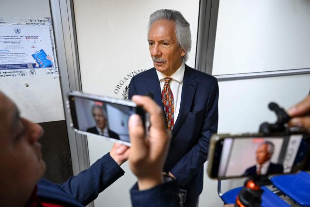 Guatemalan journalist and founder of the former newspaper "El Periodico," Jose Ruben Zamora, speaks to journalists before his hearing at the Justice Palace in Guatemala City on April 29, 2026. A court hearing will decide whether Zamora should stand trial in a second case against him. (Photo by Johan ORDONEZ / AFP)