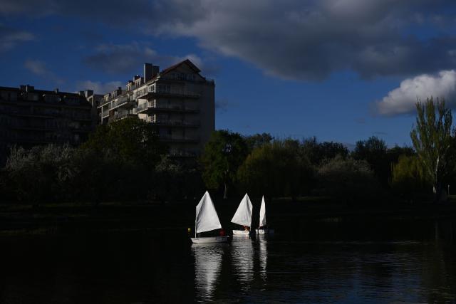 Children practice sailing on a lake in Warsaw, Poland on April 29, 2026. (Photo by Sergei GAPON / AFP)