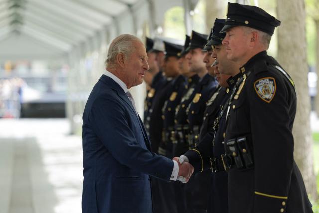 Britain's King Charles III meets the families of victims and first responders who were involved in the rescue efforts after the attacks, as well as currently serving personnel during a ceremony at the National September 11 Memorial on day three of their State Visit to the United States of America, on April 29, 2026 in New York City.. (Photo by Jeenah Moon / POOL / AFP)