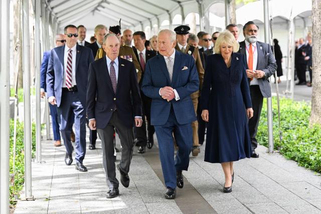 Britain’s King Charles III, Queen Camilla and Michael Bloomberg (L), chairman of the National September 11 Memorial, attend a ceremony at the National September 11 Memorial on day three of the State Visit of King Charles III and Queen Camilla to the United States of America, on April 29, 2026 in New York City. (Photo by Samir HUSSEIN / POOL / AFP)