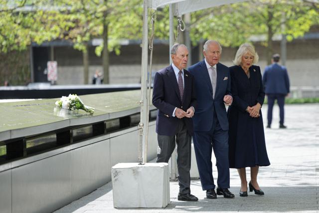Britain’s King Charles III, Queen Camilla and Michael Bloomberg (L), chairman of the National September 11 Memorial, attend a ceremony at the National September 11 Memorial on day three of the State Visit of King Charles III and Queen Camilla to the United States of America, on April 29, 2026 in New York City. (Photo by Jeenah Moon / POOL / AFP)