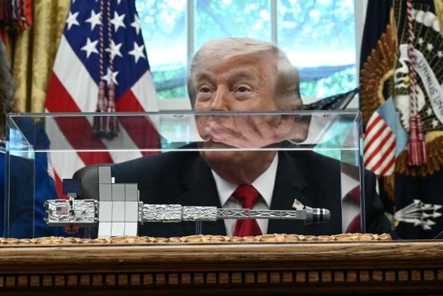 US President Donald Trump speaks as he welcomes the Artemis II astronauts in the Oval Office at the White House in Washington, DC, on April 29, 2026. (Photo by Brendan SMIALOWSKI / AFP)